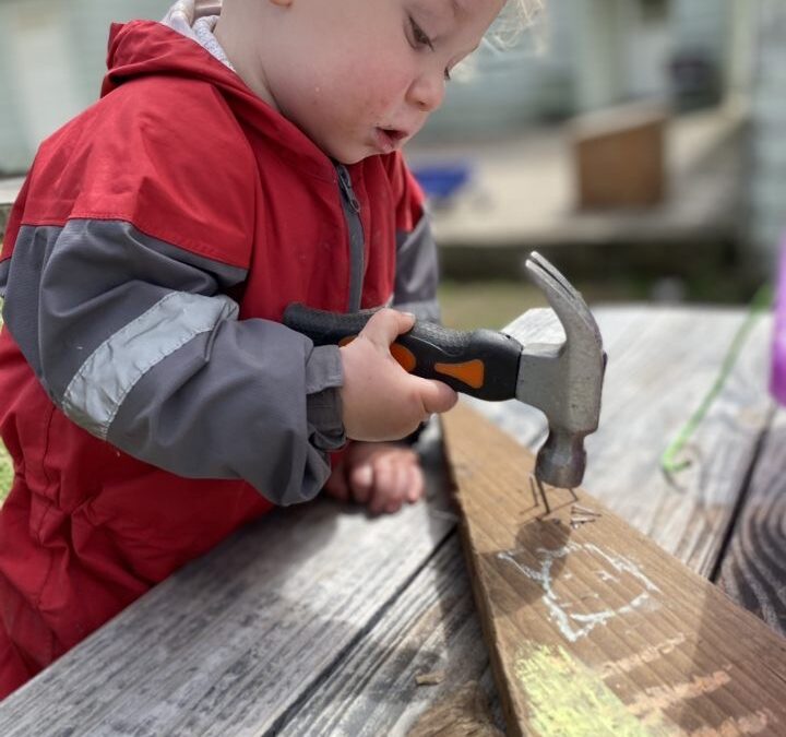 child hammering aishling forest school